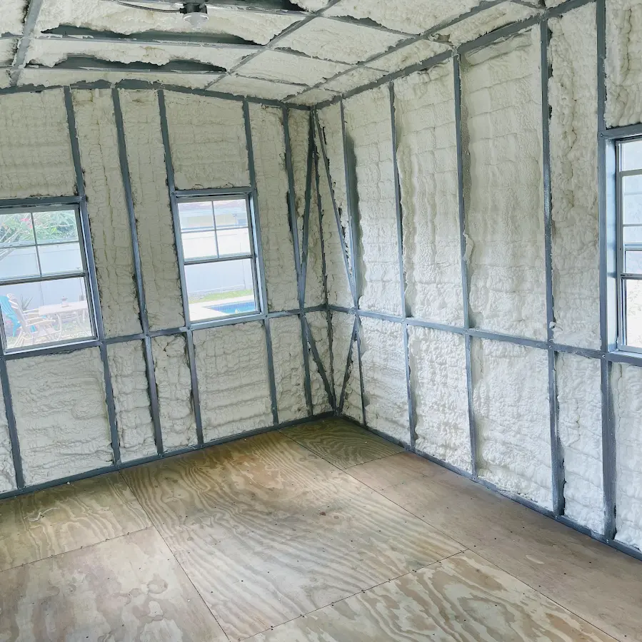 Closed-cell spray foam insulation applied to wall cavities in a residential project in Brookville